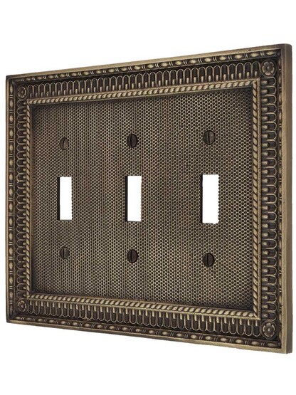 Pisano Triple Gang Toggle Switch Plate in Antique Brass.